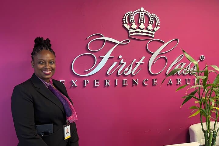 host next to first class experience aruba sign