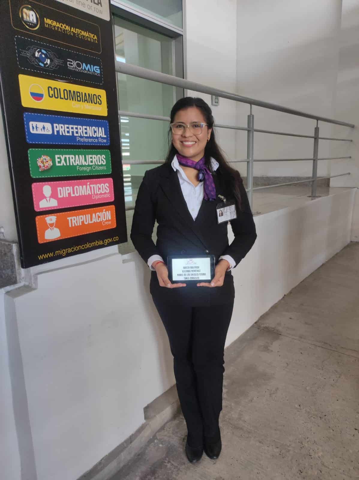 Host waiting next to sign for luxury service in colombia airport